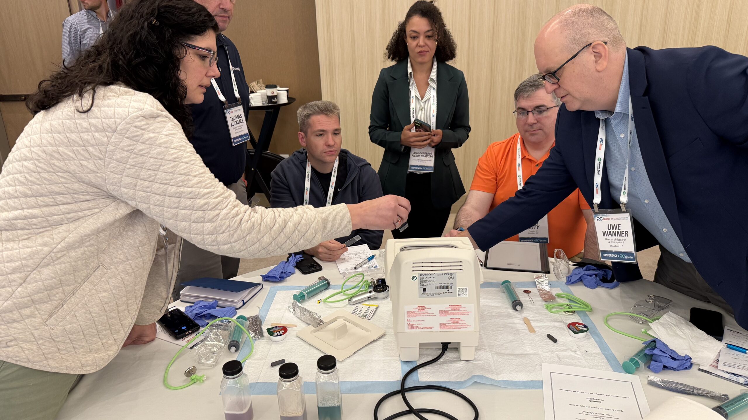 Workshop attendees working with an ultrasonic tank